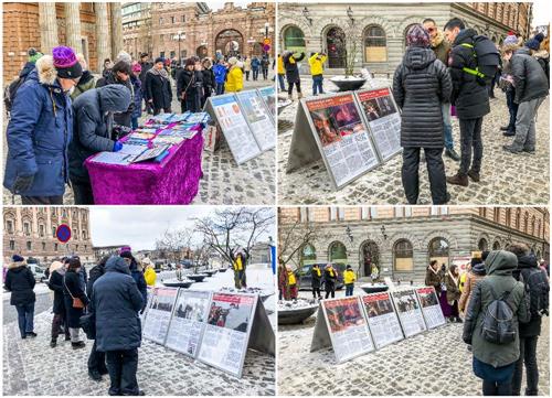 '图2：人们站在真相展板前仔细阅读，有的拿出手机拍学员祥和的炼功场面。'